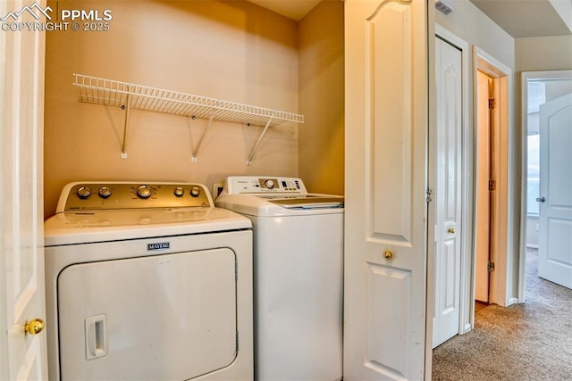 2610 Plumtree Grv, Colorado Springs, CO 80907 - washroom with carpet floors and separate washer and dryer