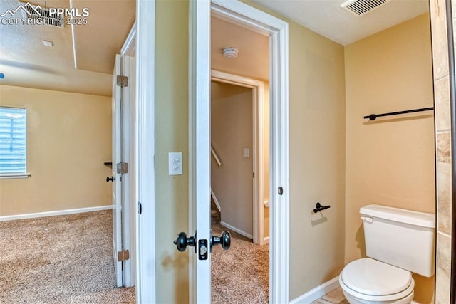 2610 Plumtree Grv, Colorado Springs, CO 80907 - bathroom with toilet and baseboards