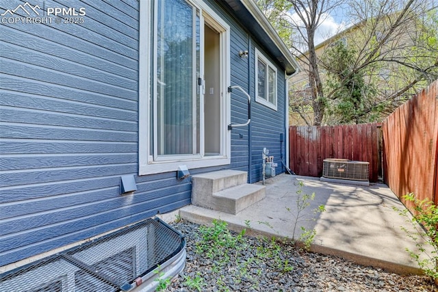 2610 Plumtree Grv, Colorado Springs, CO 80907 - view of home's exterior with fence, a patio, central AC unit, and entry steps