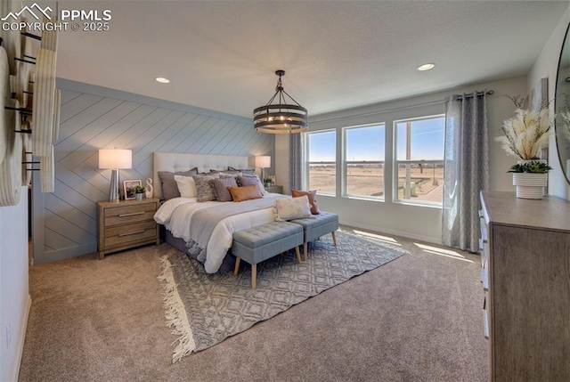bedroom with carpet flooring, recessed lighting, and a chandelier