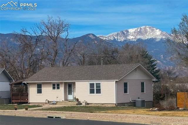 1416 N Foote Ave, Colorado Springs, CO 80909 - ranch-style house with a mountain view, central AC, and a front yard