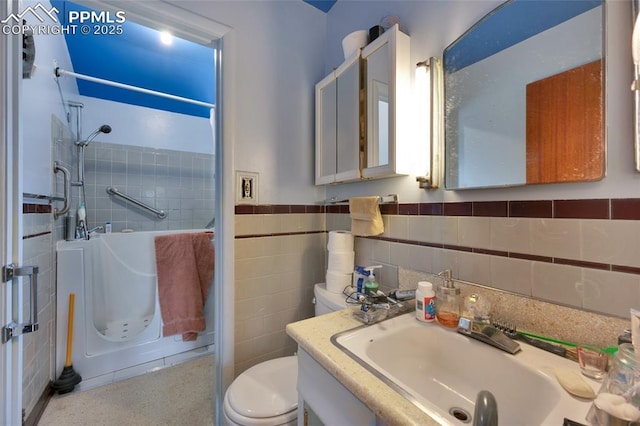 1416 N Foote Ave, Colorado Springs, CO 80909 - full bath featuring a shower, a sink, tile walls, toilet, and wainscoting