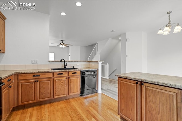 1118 Walters Pt, Monument, CO 80132 - kitchen featuring black dishwasher, ceiling fan, light wood-style flooring, a chandelier, and recessed lighting