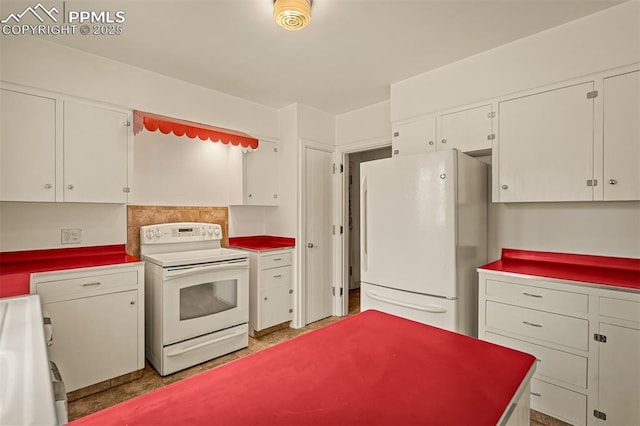 2126 Wood Ave, Colorado Springs, CO 80907 - kitchen with white appliances and white cabinetry