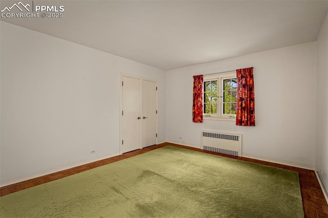2126 Wood Ave, Colorado Springs, CO 80907 - unfurnished room featuring radiator and baseboards
