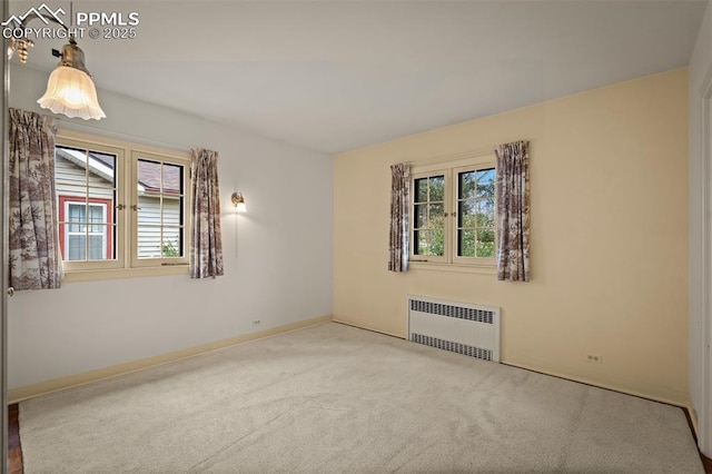 2126 Wood Ave, Colorado Springs, CO 80907 - empty room with radiator, carpet floors, and baseboards