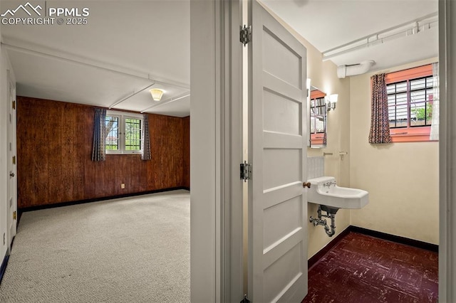 2126 Wood Ave, Colorado Springs, CO 80907 - corridor with wooden walls and baseboards