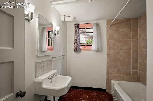 2126 Wood Ave, Colorado Springs, CO 80907 - full bathroom with a sink, tile patterned floors, and shower / bath combination