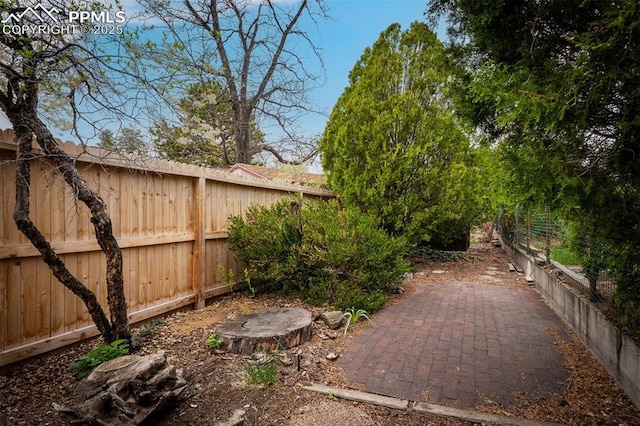 2126 Wood Ave, Colorado Springs, CO 80907 - fenced backyard featuring a patio area