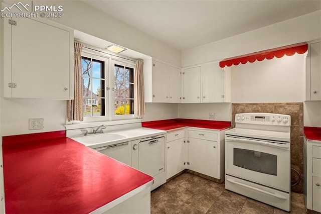 2126 Wood Ave, Colorado Springs, CO 80907 - kitchen with white range with electric cooktop, a sink, and white cabinetry