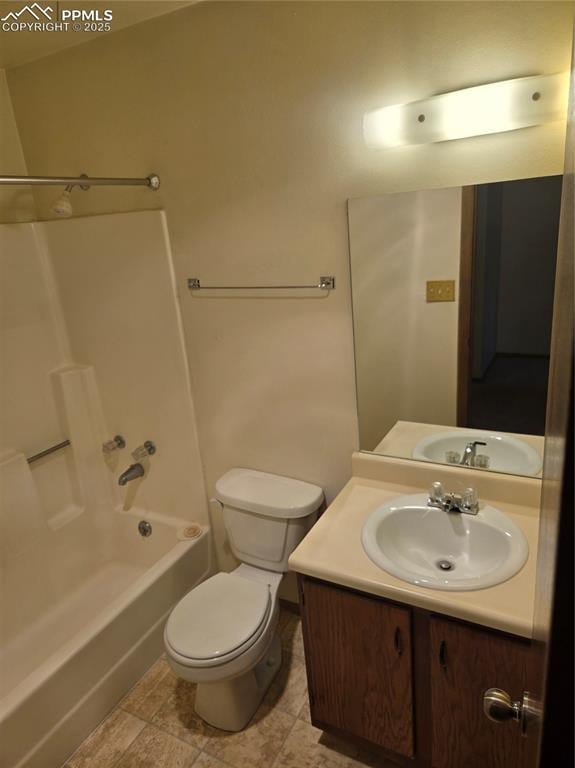 full bathroom featuring toilet, washtub / shower combination, and vanity