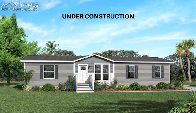 5557 Sengbeil Rd, Yoder, CO 80864 - manufactured / mobile home featuring a front yard