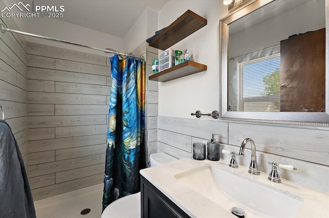 3425 Post Oak Dr, Colorado Springs, CO 80916 - full bathroom featuring toilet, a shower stall, wooden walls, and vanity