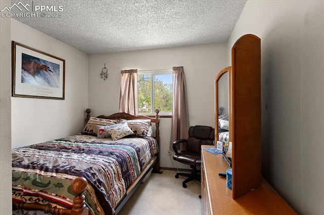 3425 Post Oak Dr, Colorado Springs, CO 80916 - bedroom with a textured ceiling and carpet flooring