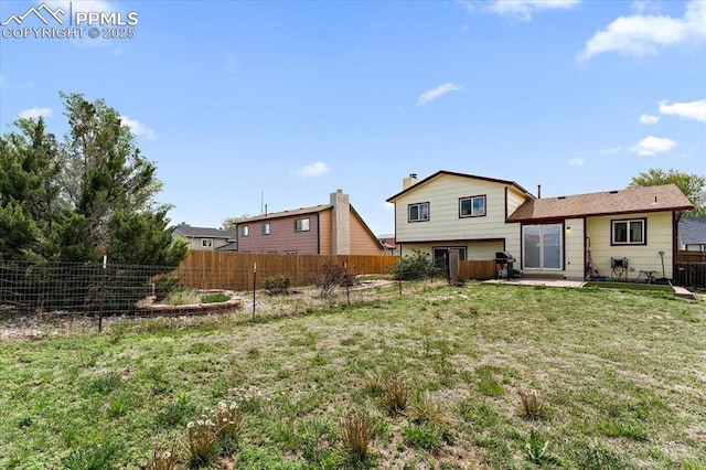3425 Post Oak Dr, Colorado Springs, CO 80916 - rear view of house featuring a patio area