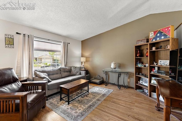 3425 Post Oak Dr, Colorado Springs, CO 80916 - living room with light wood-style floors and a textured ceiling
