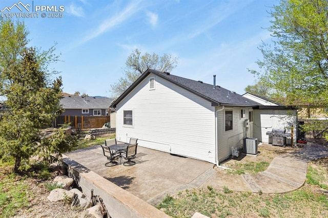 back of property with a patio area, cooling unit, and fence