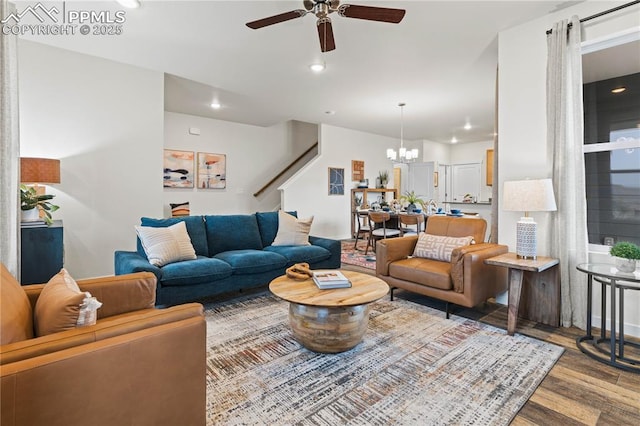 5131 Roundhouse Dr, Colorado Springs, CO 80925 - living area featuring stairs, wood finished floors, recessed lighting, and ceiling fan with notable chandelier