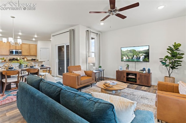 5131 Roundhouse Dr, Colorado Springs, CO 80925 - living area with recessed lighting, ceiling fan with notable chandelier, and light wood-style floors