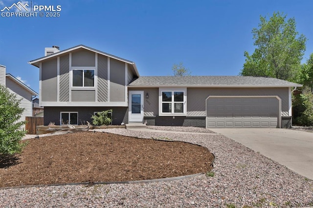 7920 Conifer Dr, Colorado Springs, CO 80920 - split level home featuring brick siding, a garage, concrete driveway, and entry steps