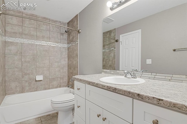 7920 Conifer Dr, Colorado Springs, CO 80920 - full bath featuring vanity, washtub / shower combination, tile patterned floors, and toilet