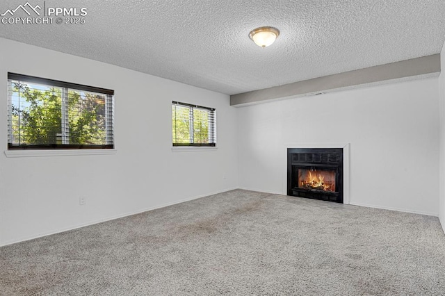 7920 Conifer Dr, Colorado Springs, CO 80920 - unfurnished living room featuring carpet, a textured ceiling, and a fireplace with flush hearth
