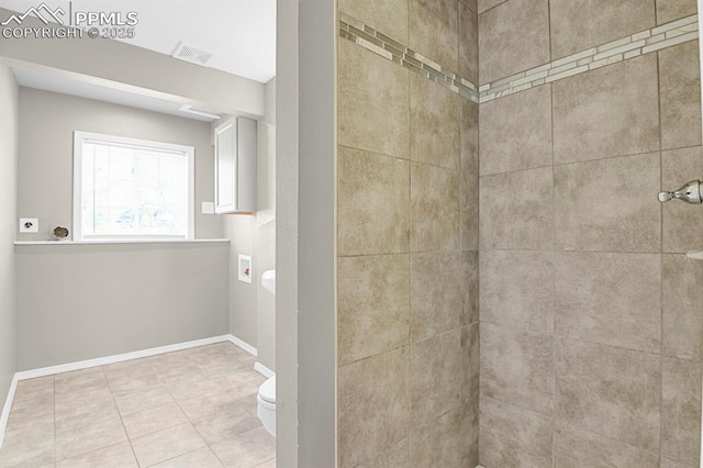 7920 Conifer Dr, Colorado Springs, CO 80920 - full bath with toilet, tiled shower, tile patterned flooring, and baseboards