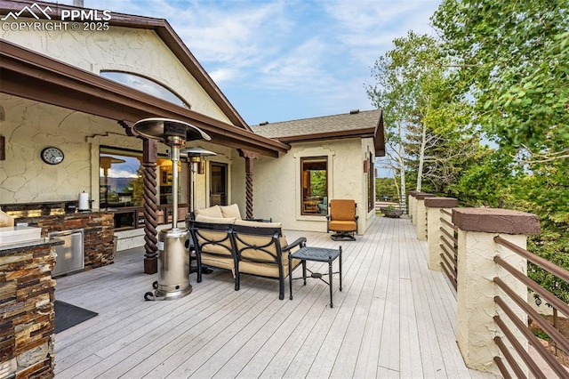 17995 Minglewood Trl, Monument, CO 80132 - deck featuring exterior kitchen and an outdoor living space