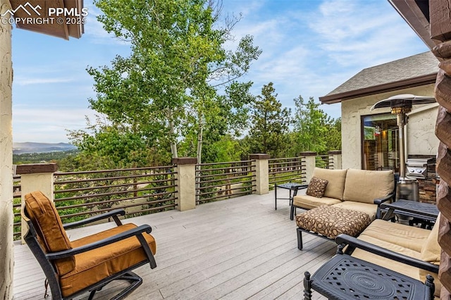 17995 Minglewood Trl, Monument, CO 80132 - wooden terrace with an outdoor hangout area