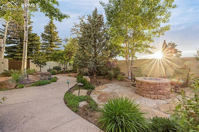 17995 Minglewood Trl, Monument, CO 80132 - view of yard with an outdoor fire pit and a patio area