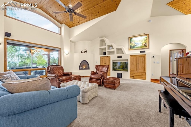 17995 Minglewood Trl, Monument, CO 80132 - carpeted living area with high vaulted ceiling, healthy amount of natural light, wood ceiling, built in features, and arched walkways