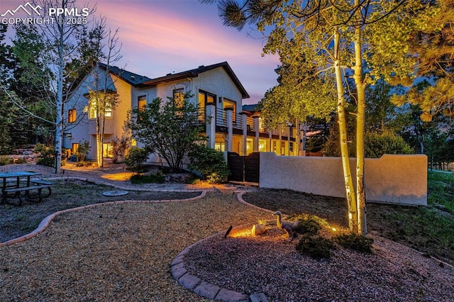 17995 Minglewood Trl, Monument, CO 80132 - rear view of house featuring stucco siding