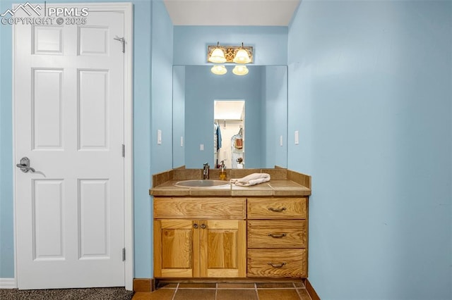 17995 Minglewood Trl, Monument, CO 80132 - bathroom featuring vanity and baseboards
