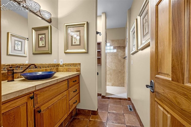 17995 Minglewood Trl, Monument, CO 80132 - bathroom featuring vanity and a tile shower