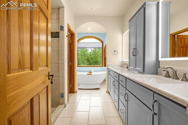 17995 Minglewood Trl, Monument, CO 80132 - bathroom with double vanity, tile patterned flooring, a soaking tub, and a shower stall