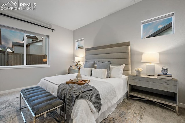 bedroom featuring carpet flooring and baseboards
