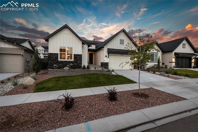 modern inspired farmhouse featuring board and batten siding, driveway, a front yard, stone siding, and a garage