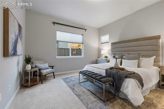 carpeted bedroom featuring baseboards