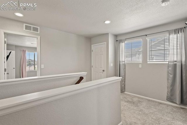 7238 Fauna Glen Dr, Colorado Springs, CO 80927 - hallway featuring carpet flooring, a textured ceiling, and recessed lighting