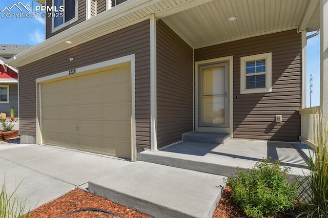 7238 Fauna Glen Dr, Colorado Springs, CO 80927 - doorway to property featuring an attached garage and concrete driveway