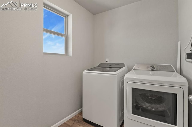 7238 Fauna Glen Dr, Colorado Springs, CO 80927 - laundry area with washer and dryer and wood finished floors