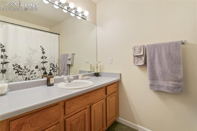 bathroom featuring vanity and baseboards