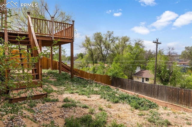 4650 Cassidy St, Colorado Springs, CO 80911 - view of yard with a fenced backyard, a deck, and stairway