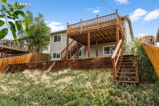4650 Cassidy St, Colorado Springs, CO 80911 - back of house featuring stairs, a deck, and fence