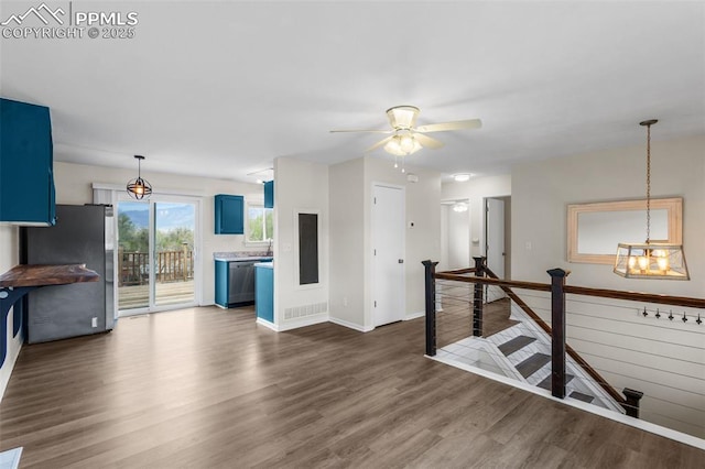 4650 Cassidy St, Colorado Springs, CO 80911 - interior space featuring stainless steel appliances, dark wood-type flooring, a ceiling fan, blue cabinetry, and baseboards