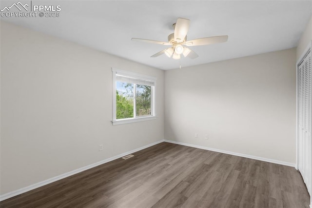 4650 Cassidy St, Colorado Springs, CO 80911 - unfurnished bedroom with a closet, wood finished floors, visible vents, a ceiling fan, and baseboards
