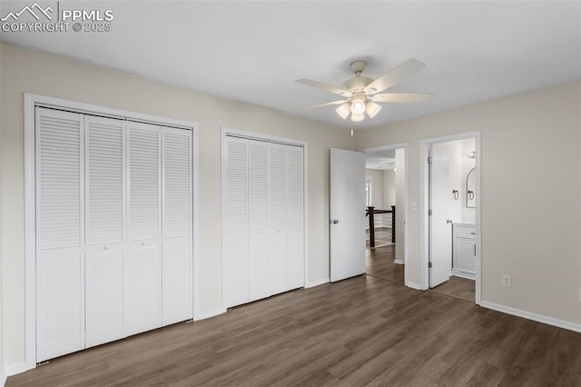 4650 Cassidy St, Colorado Springs, CO 80911 - unfurnished bedroom featuring wood finished floors, ensuite bath, two closets, ceiling fan, and baseboards