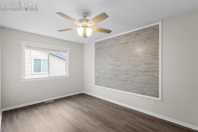 4650 Cassidy St, Colorado Springs, CO 80911 - unfurnished room with baseboards, a ceiling fan, visible vents, and wood finished floors