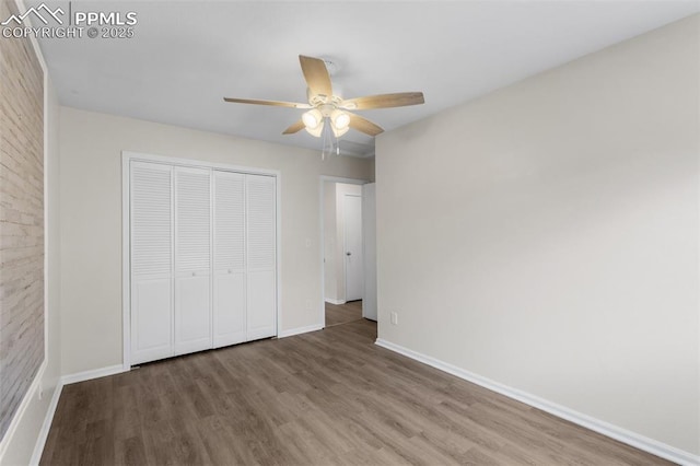 4650 Cassidy St, Colorado Springs, CO 80911 - unfurnished bedroom with a closet, a ceiling fan, wood finished floors, and baseboards