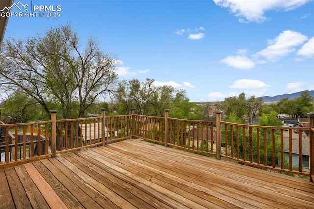 4650 Cassidy St, Colorado Springs, CO 80911 - wooden deck featuring a mountain view